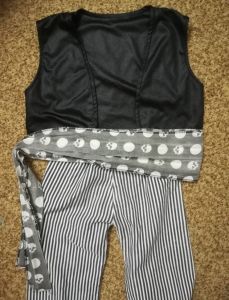 Kids Costumes to Hire - Pirate Boy - Stripe B&W pants, black waistcoat, skull belt